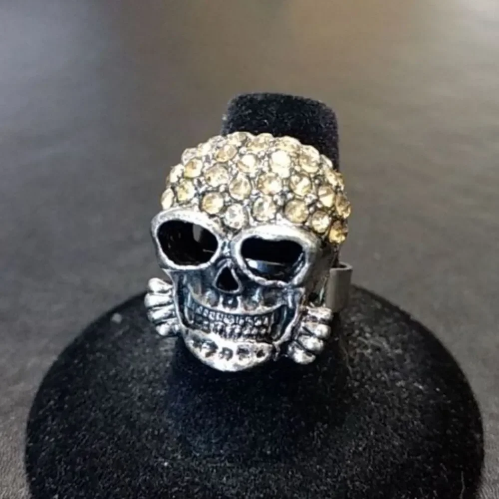 Silver tone and rhinestone skull ring adjustable